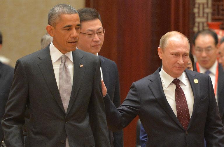 Russian President Vladimir Putin (right) discussed the Ukraine crisis with his US counterpart Barack Obama on the sidelines of the Asia-Pacific Economic Cooperation (APEC) summit in Beijing, on November 11, 2014