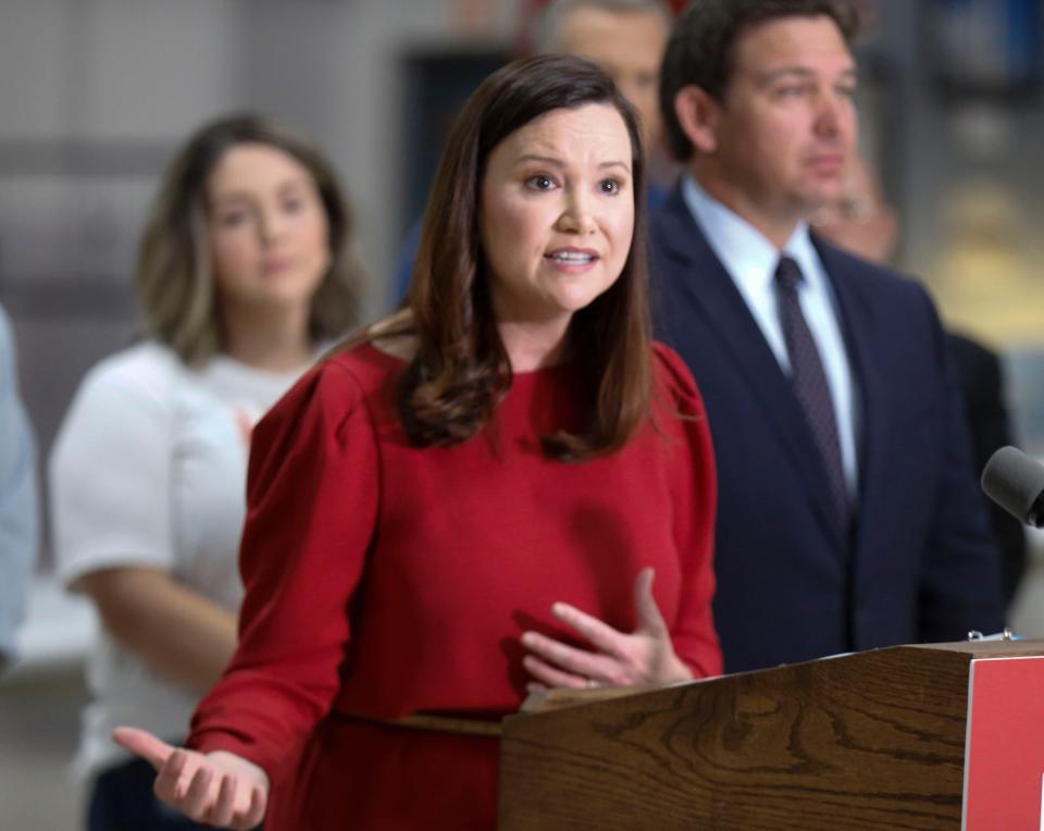 Florida Attorney General Ashley Moody addresses the media in October about supporting the state filing a lawsuit to block the Biden administration over vaccine mandates on federal workers. Friday her office dropped its appeal against requiring health care workers to be vaccinated.