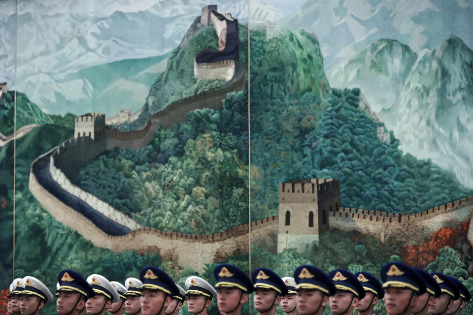 Members of an honor guard stand near a Great Wall of China painting during a welcome ceremony held by Chinese Premier Li Keqiang for visiting Israeli Prime Minister Benjamin at the Great Hall of the People in Beijing, Monday, March 20, 2017. (AP Photo/Andy Wong)