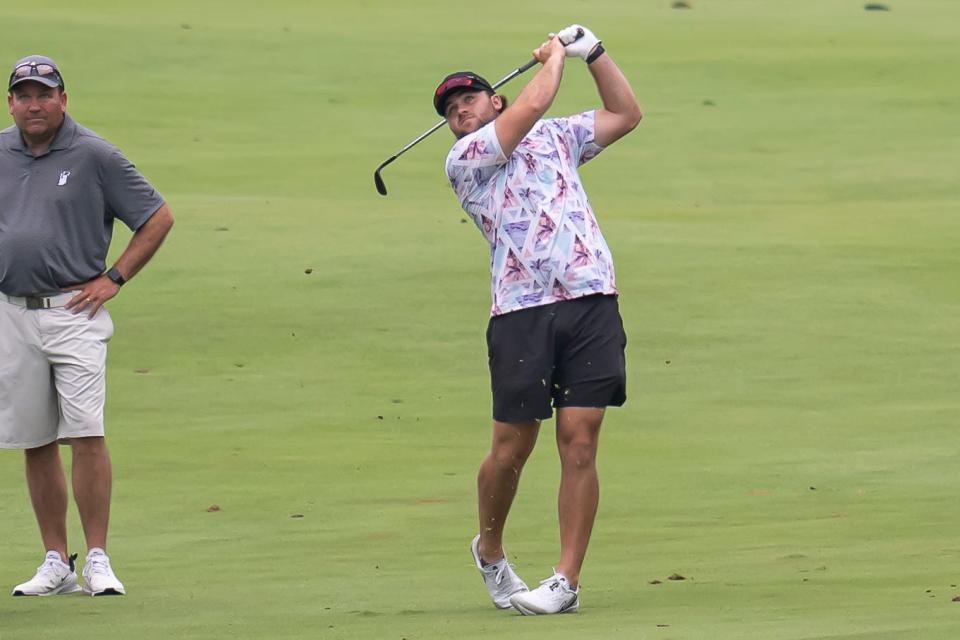 Jack Ross follows through after his approach shot on #9 at the Men's City Golf Tournament, presented by the Bob Rohrman Auto Group, Sunday Jul. 17, 2022 in West Lafayette.