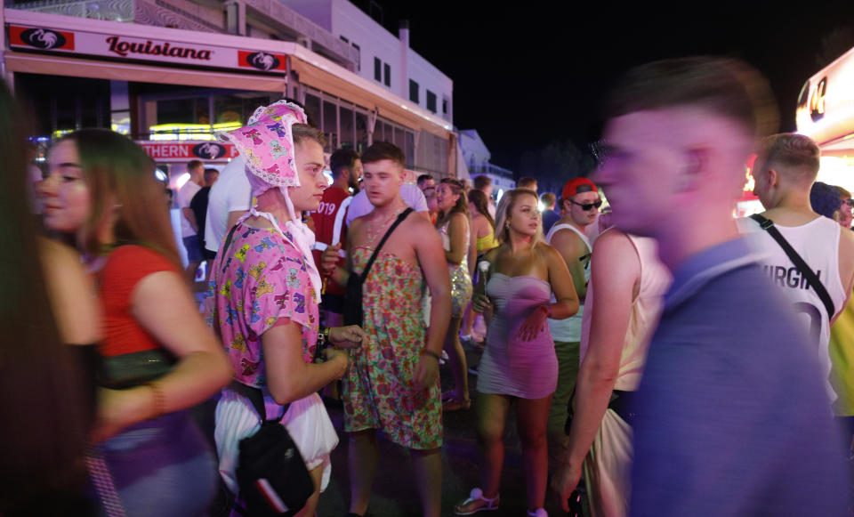 MAGALUF, SPAIN - JUNE 30: Tourists visit the popular Punta Ballena strip on June 30, 2019 in Magaluf, Spain. Magaluf, where most of the nightclubs and bars are located, is one of the main destinations for British tourists during the summer season. (Photo by Clara Margais/Getty Images)