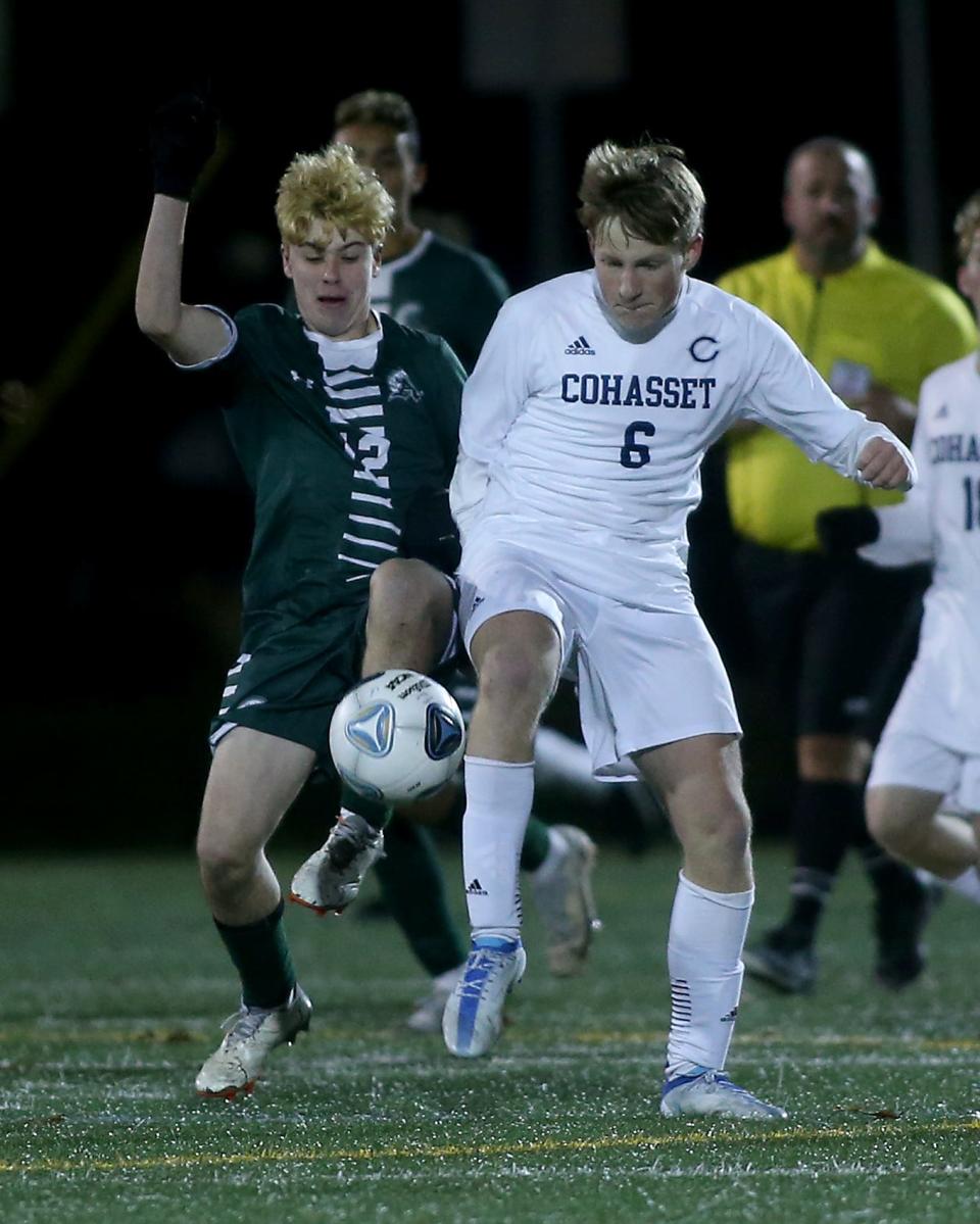 Abington's Liam Murtagh and Cohasset's Nate Livermore battle for possession during the first OT of their Round of 16 game against Cohasset in the Division 4 state tournament at Abington High on Wednesday, Nov. 9, 2022. Cohasset would win 3-2 in OT. 