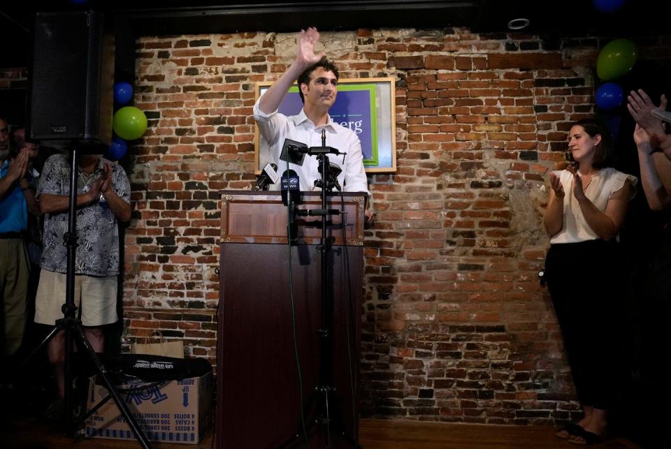 Aaron Regunberg concedes to Gabe Amo at the Wild Colonial tavern in Providence, after failing to win the RI Democratic primary on Tuesday, Sept. 5, 2023. His wife, Katie, watches from the side.