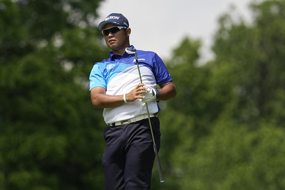 Hideki Matsuyama, of Japan, watches his shot on the ninth fairway during the first round of the Memorial golf tournament, Thursday, June 2, 2022, in Dublin, Ohio. (AP Photo/Darron Cummings)