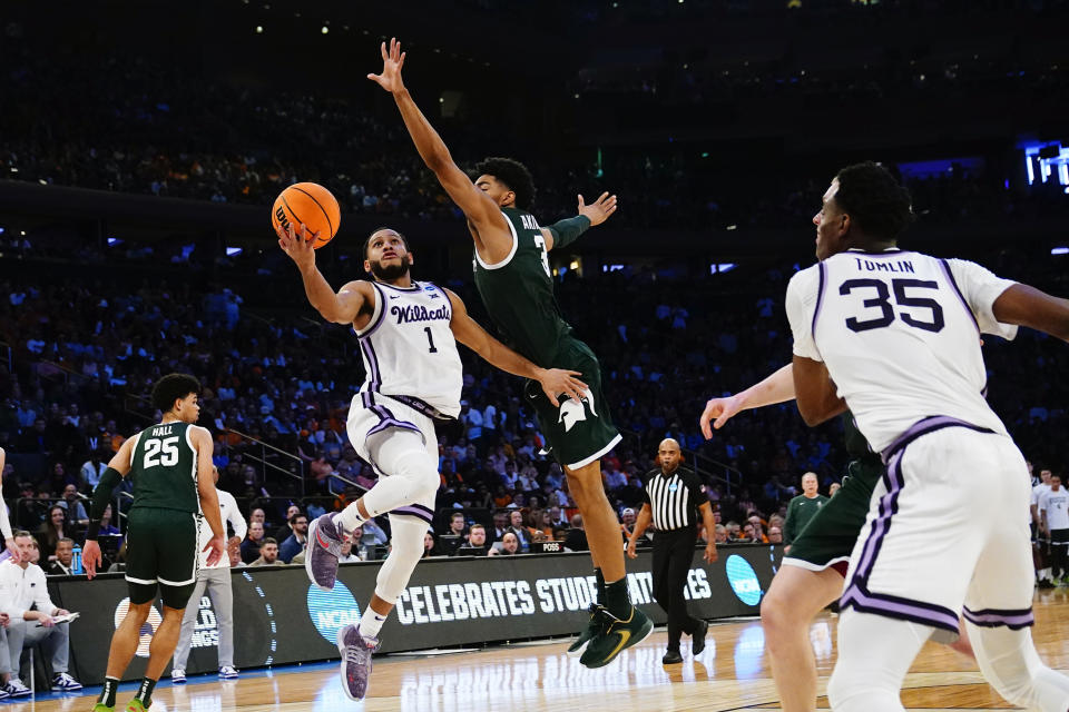 Kansas State guard Markquis Nowell (1) attempts a layup as Michigan State guard Jaden Akins (3) defends in overtime of a Sweet 16 college basketball game in the East Regional of the NCAA tournament at Madison Square Garden, Thursday, March 23, 2023, in New York. (AP Photo/Frank Franklin II)