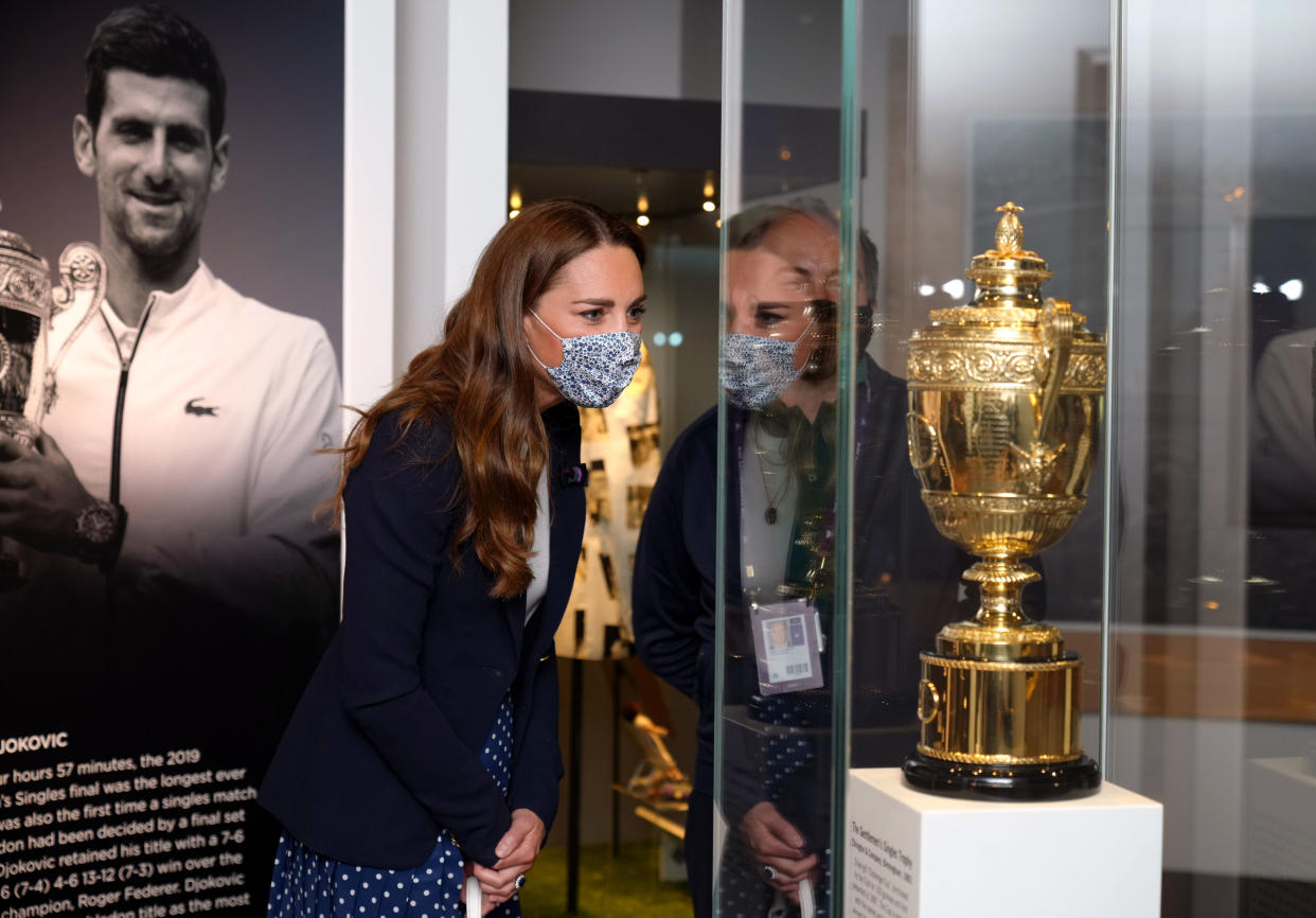 LONDON, ENGLAND - JULY 02: Catherine, Duchess of Cambridge is shown around the Wimbledon Museum by the Head of Heritage at the All England Lawn Tennis Club Adam Chadwick during her official visit on day five of Wimbledon at The All England Lawn Tennis and Croquet Club, on July 2, 2021 in London, England. (Photo by John Walton - WPA Pool/Getty Images)