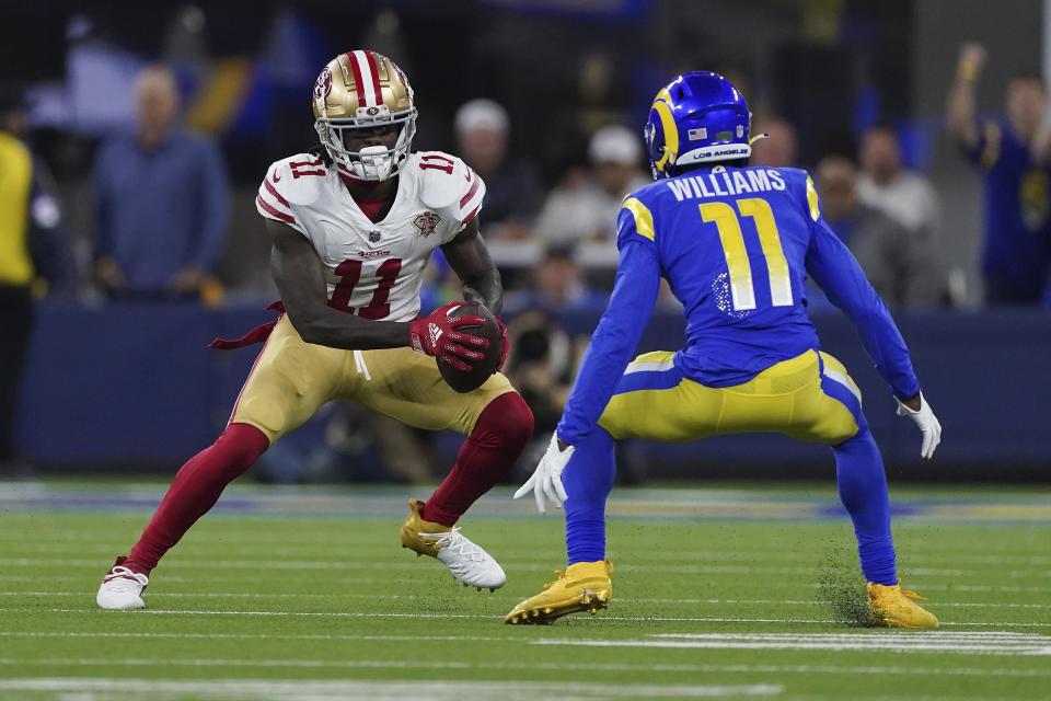 Los Angeles Rams cornerback and Creekside High product Darious Williams (11), getting ready to make a tackle on San Francisco 49ers receiver Brandon Aiyuk in the NFC Championship game, will be an unrestricted free agent after Sunday's Super Bowl and could cash in big on the open market.