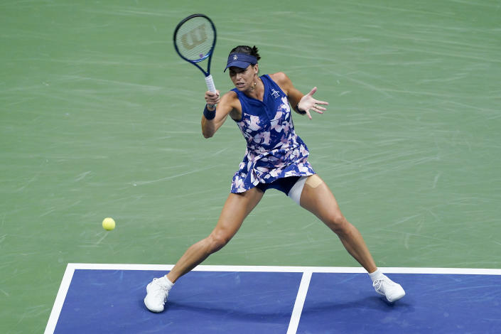 Ajla Tomljanovic, of Austrailia, returns a shot to Ons Jabeur, of Tunisia, during the quarterfinals of the U.S. Open tennis championships, Tuesday, Sept. 6, 2022, in New York. (AP Photo/Seth Wenig)