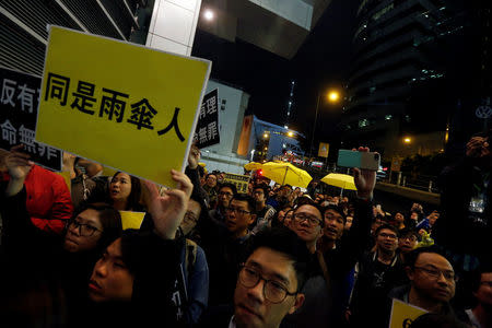 Pro-democracy protesters supporting Occupy Central movement demonstrate outside the police headquarters in Hong Kong, China March 27, 2017. REUTERS/Bobby Yip