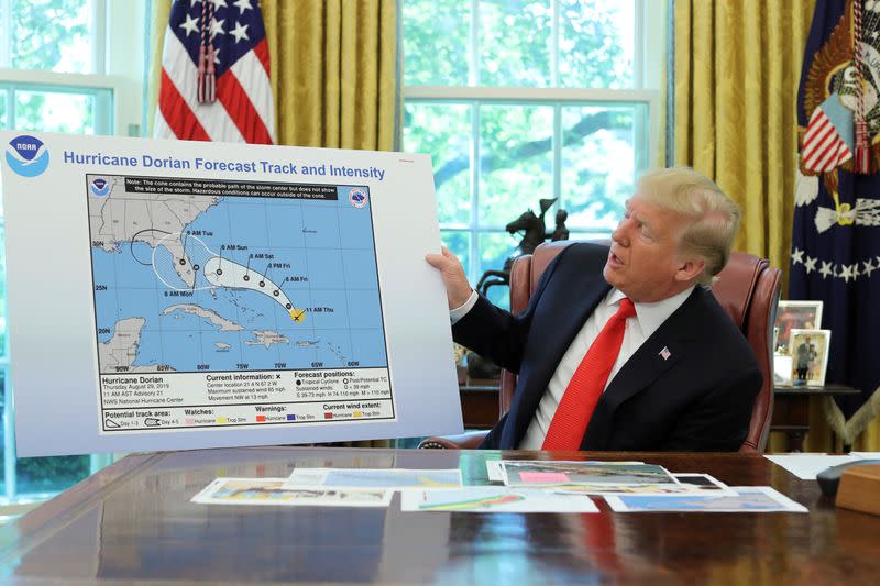 FILE PHOTO: U.S. President Trump receives a Hurricane Dorian update at the White House in Washington