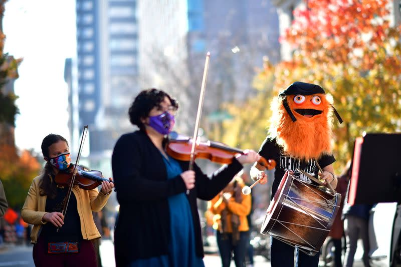 A band featuring Gritty, the Philadelphia Flyers hockey team mascot, plays in celebration after Democratic presidential nominee Joe Biden overtook President Donald Trump in the Pennsylvania general election vote in Philadelphia