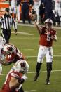 Wisconsin quarterback Graham Mertze throws a touchdown pass to Wisconsin's Mason Stokke during the first half of an NCAA college football game against Illinois Friday, Oct. 23, 2020, in Madison, Wis. (AP Photo/Morry Gash)