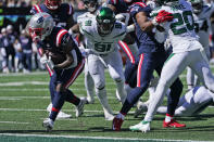 New England Patriots' James White, left, runs for a touchdown during the first half of an NFL football game against the New York Jets, Sunday, Sept. 19, 2021, in East Rutherford, N.J. (AP Photo/Frank Franklin II)