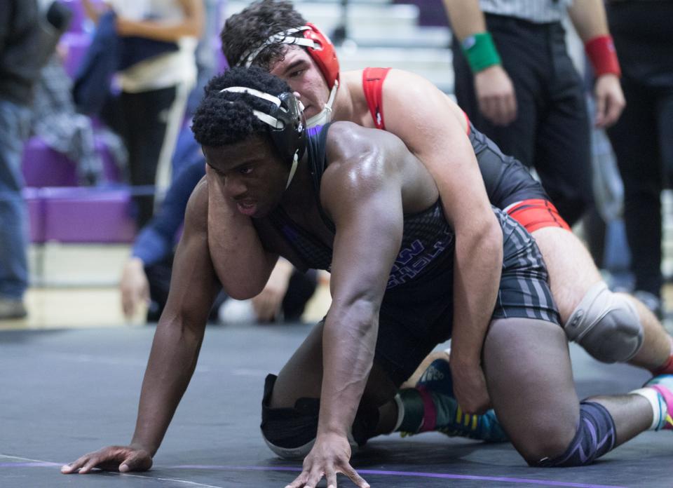 Fox Lane's Alex Berisha (top) defeated New Rochelle's DeAndre Woods in the 189-pound finals of the Murphy-Guccione Shoreline Classic wrestling tournament at New Rochelle High School on Saturday, Jan. 7, 2023.