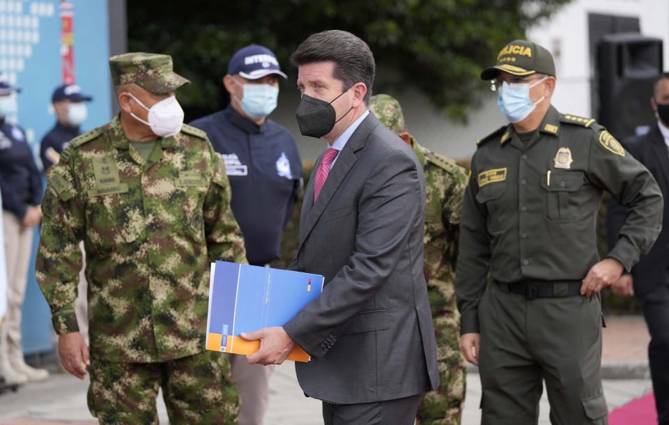 FILE - In this July 12, 2021 file photo, Colombian Defense Minister Diego Molano, center, Colombia's National Police Director Gen. Jorge Luis Vargas, right, and Colombian Armed Forces Commander Gen. Luis Fernando Navarro, left, leave after giving a press conference in Bogota, Colombia. The officials announced the government will continue to help with the investigation of alleged participation of former Colombian soldiers in the assassination of Haiti's President Jovenel Moise. (AP Photo/Fernando Vergara, File)