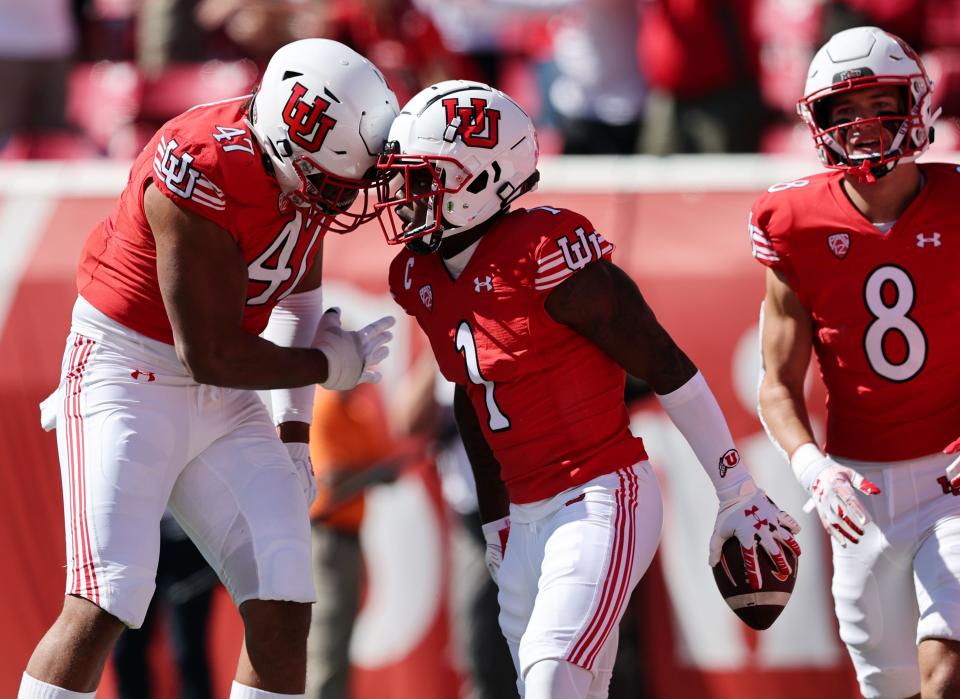 Utah Utes cornerback Clark Phillips III (1) celebrates with teammate Utah Utes running back Jaylon Glover (1) after Glover scored a touchdown as Utah and Oregon State play at Rice Eccles Stadium in Salt Lake City on Saturday, Oct. 1, 2022. | Scott G Winterton, Deseret News