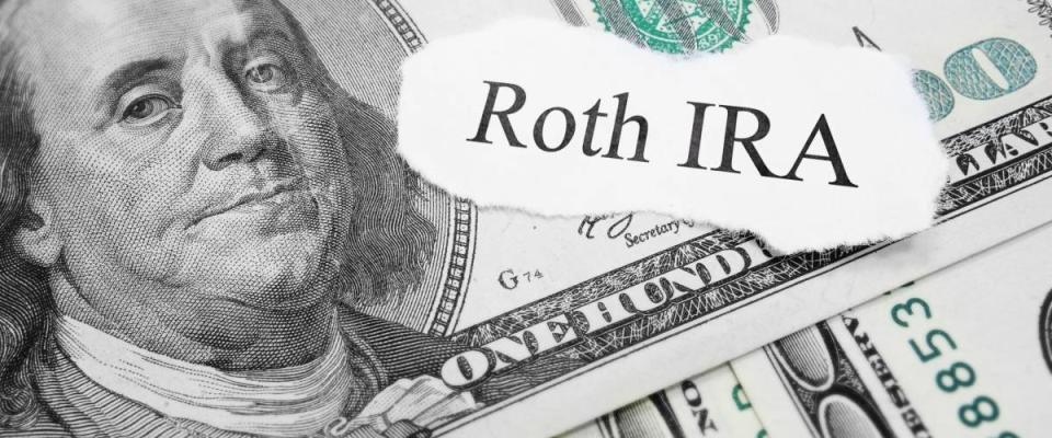 Roth IRA paper message on hundred dollar bills