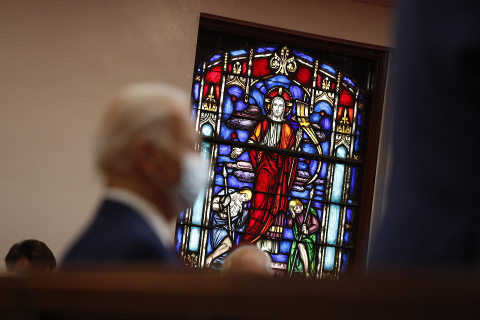 With a stained glass window in the background, Democratic presidential candidate, former Vice President Joe Biden visits Bethel AME Church in Wilmington, Del., Monday, June 1, 2020, (AP Photo/Andrew Harnik)