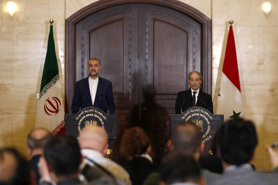 Iranian Foreign Minister Hossein Amirabdollahian, left, speaks during a joint press conference with Syrian Foreign Minister Faisal Mekdad in Damascus, Syria, Monday, April 8, 2024. Iran's foreign minister Monday accused the United States of giving Israel the "green light" to strike its consulate building in Syria that killed seven Iranian military officials including two generals. (AP Photo/Omar Sanadiki)