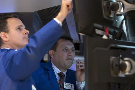 Traders work on the floor of the New York Stock Exchange May 18, 2015. REUTERS/Brendan McDermid