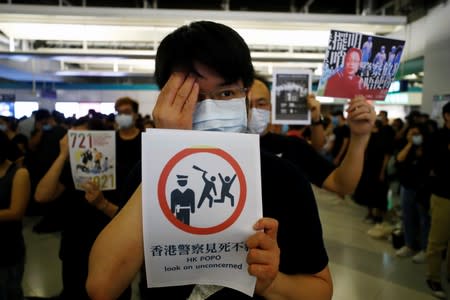 Protest at Yuen Long MTR station, the scene of an attack by suspected triad gang members a month ago