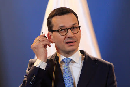 FILE PHOTO: Polish Prime Minister Mateusz Morawiecki attends a joint news conference with Hungarian Prime Minister Viktor Orban (not pictured) in Budapest, Hungary January 3, 2018. REUTERS/Bernadett Szabo