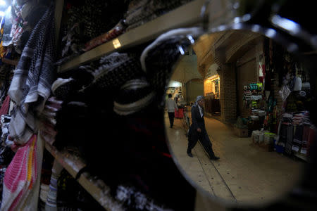 A shop that sells traditional Kurdish costumes is pictured in the old city of Erbil, Iraq September 23, 2017. REUTERS/Alaa Al-Marjani