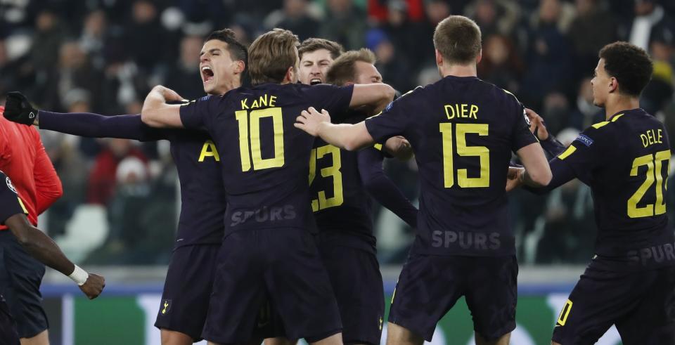 Christian Eriksen celebrates with teammates after scoring his side’s second goal during the Champions League