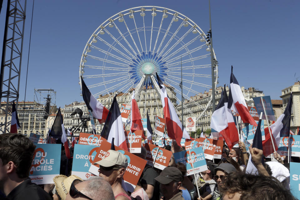 Supporters of French hard-left presidential candidate, Jean-Luc Melenchon, arrive to a attend a campaign rally in Marseille's Old Port, southern France, Sunday, April 9, 2017. The two-round presidential election is set for April 23 and May 7. (AP Photo/Claude Paris)
