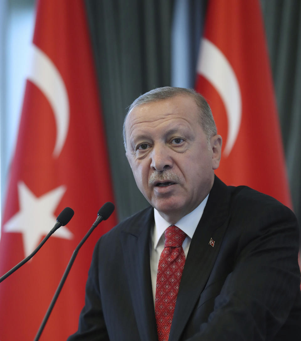 Turkey's President Recep Tayyip Erdogan speaks to a group of US businessmen at his palace, in Ankara, Turkey, Tuesday, Sept. 10, 2019. Turkey accused the United States on Tuesday of taking only "cosmetic steps" toward the creation of a so-called "safe zone" in northeast Syria and renewed Ankara's threat of unilateral military intervention to form a buffer area along its border.(Presidential Press Service via AP, Pool)