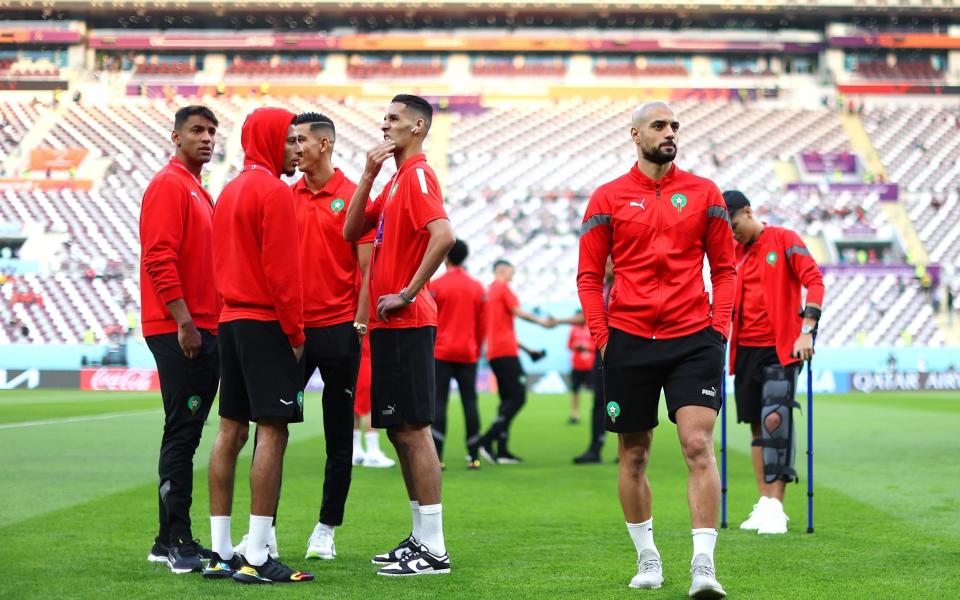 Morocco players inspect the pitch - Maja Hitij/Getty Images