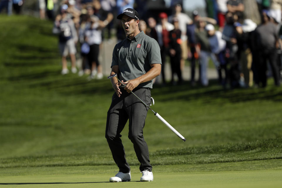 Adam Scott, of Australia, reacts as his putt for birdie just misses on the second hole of the South Course at Torrey Pines Golf Course during the final round of the Farmers Insurance golf tournament Sunday, Jan. 27, 2019, in San Diego. (AP Photo/Gregory Bull)