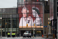 <p>Portraits of Queen Elizabeth II are displayed at the National Arts centre in downtown Ottawa ahead of a memorial service for Britain's Queen Elizabeth II on September 19, 2022.</p> <p>(Photo by DAVE CHAN/AFP via Getty Images)</p> 
