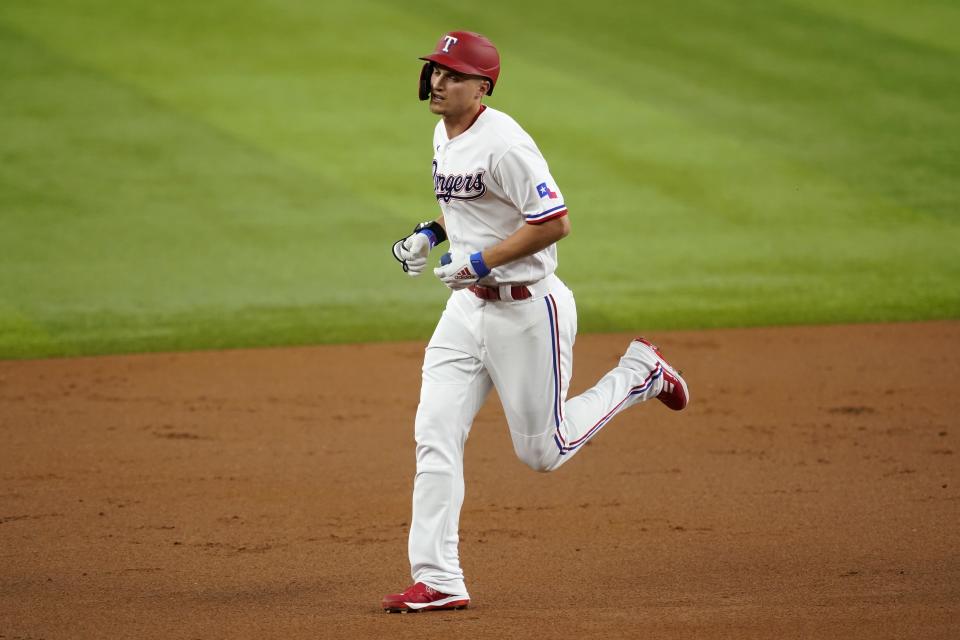 Texas Rangers' Corey Seager rounds the bases after hitting a solo home run in the first inning of a baseball game against the Kansas City Royals, Tuesday, May 10, 2022, in Arlington, Texas. (AP Photo/Tony Gutierrez)