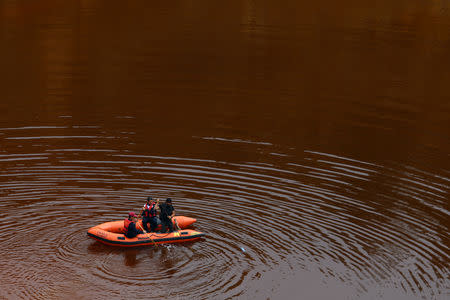 Forensic officers search Kokkinopezoula lake, also known as "red lake", for possible bodies of victims of a suspected serial killer near the village of Mitsero, Cyprus, May 1, 2019. REUTERS/Yiannis Kourtoglou