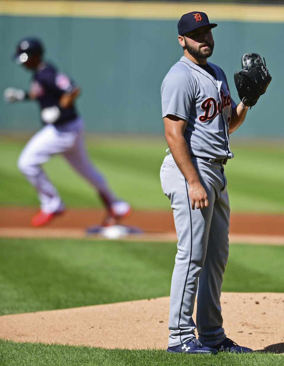 Detroit Tigers starting pitcher Michael Fulmer waits for Cleveland Indians' Michael Brantley to run the bases after hitting a solo home run in the first inning of a baseball game, Saturday, Sept.15, 2018, in Cleveland. (AP Photo/David Dermer)