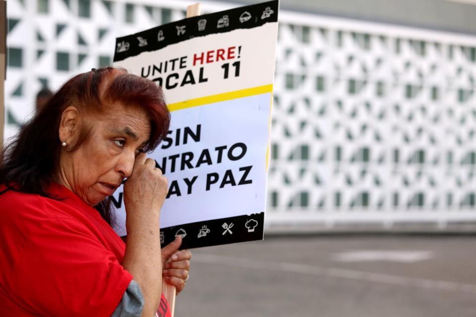 Esther Dorado holding a Unite Here sign