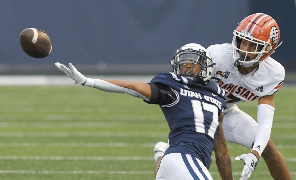 Utah State cornerback Avante Dickerson (17) breaks up a pass intended for Idaho State wide receiver Cyrus Wallace during the first half of an NCAA college football game Saturday, Sept. 9, 2023, in Logan, Utah. | Eli Lucero/The Herald Journal via AP