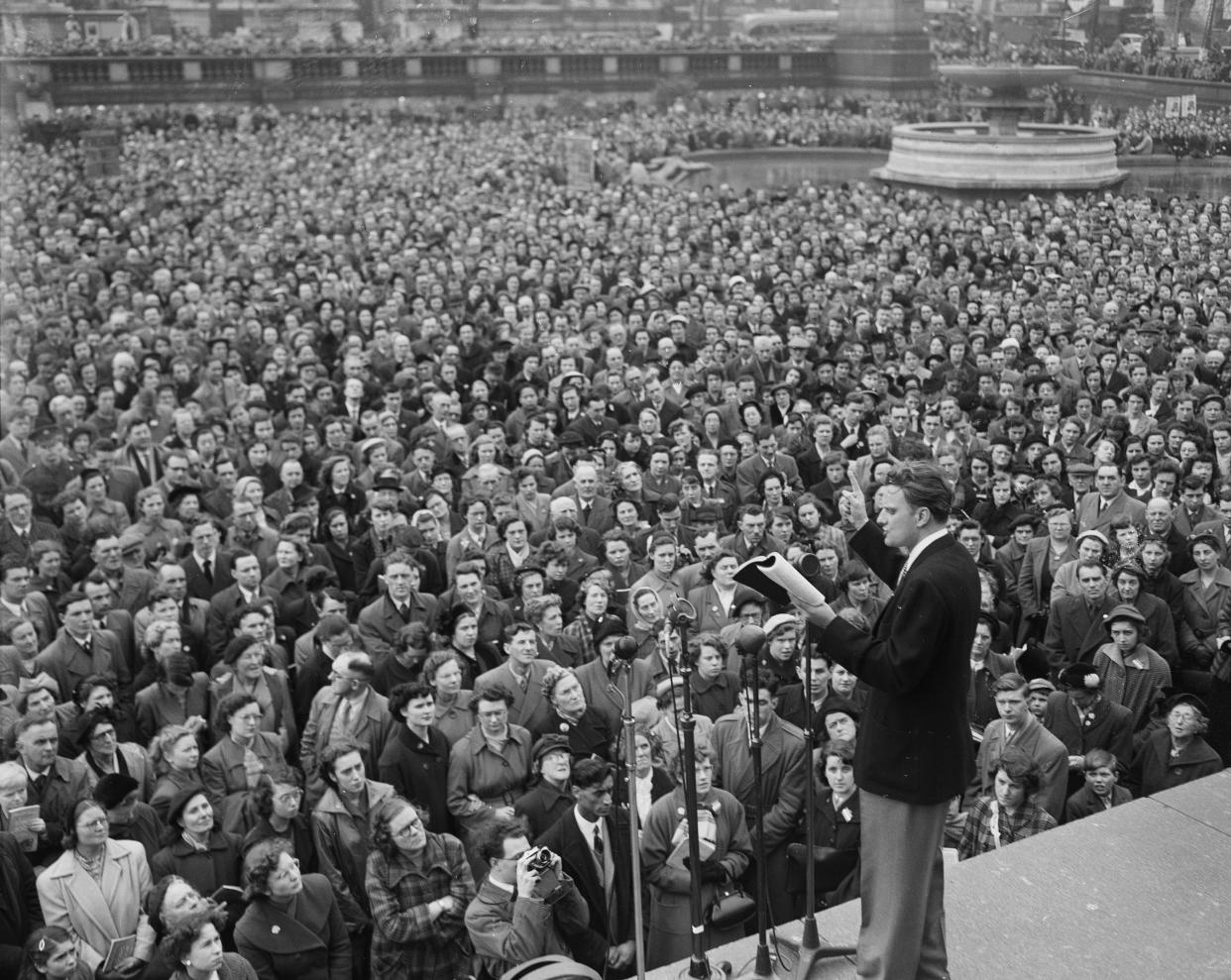 Evangelist Billy Graham preaches to a rapt audience in Trafalgar Square, London, April 12, 1954. (Photo: AP)