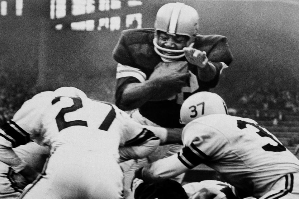 Browns running back Jim Brown sails over the goal line for a fourth-quarter touchdown against the Pittsburgh Steelers, Oct. 2, 1960, in Cleveland.