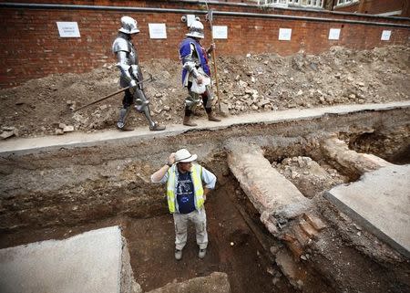 Archaeologist Mathew Morris stands in the trench where he found skeleton remains during an archaeological dig to find the remains of King Richard III in Leicester, central England September 12, 2012. REUTERS/Darren Staples