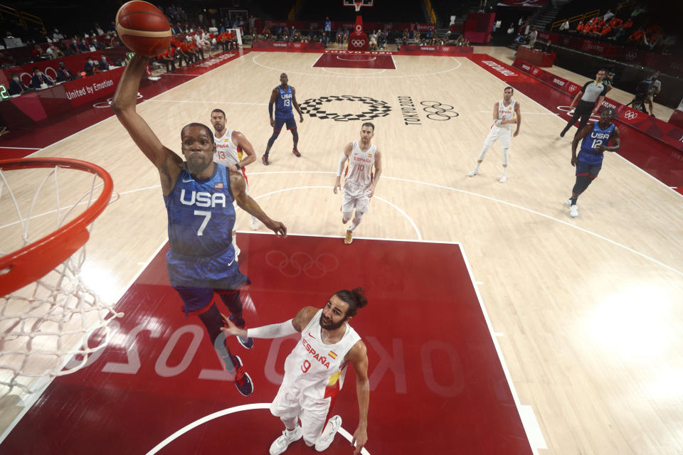 United States' Kevin Durant (7) drives to the basket over Spain's Ricky Rubio (9) during a men's basketball quarterfinal round game at the 2020 Summer Olympics, Tuesday, Aug. 3, 2021, in Saitama, Japan. (Gregory Shamus/Pool Photo via AP)