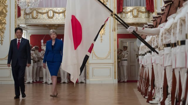 Japanese Prime Minister Shinzo Abe welcomes British Prime Minister Theresa May to the Akasaka Guest House in Tokyo (Stefan Rousseau/PA)