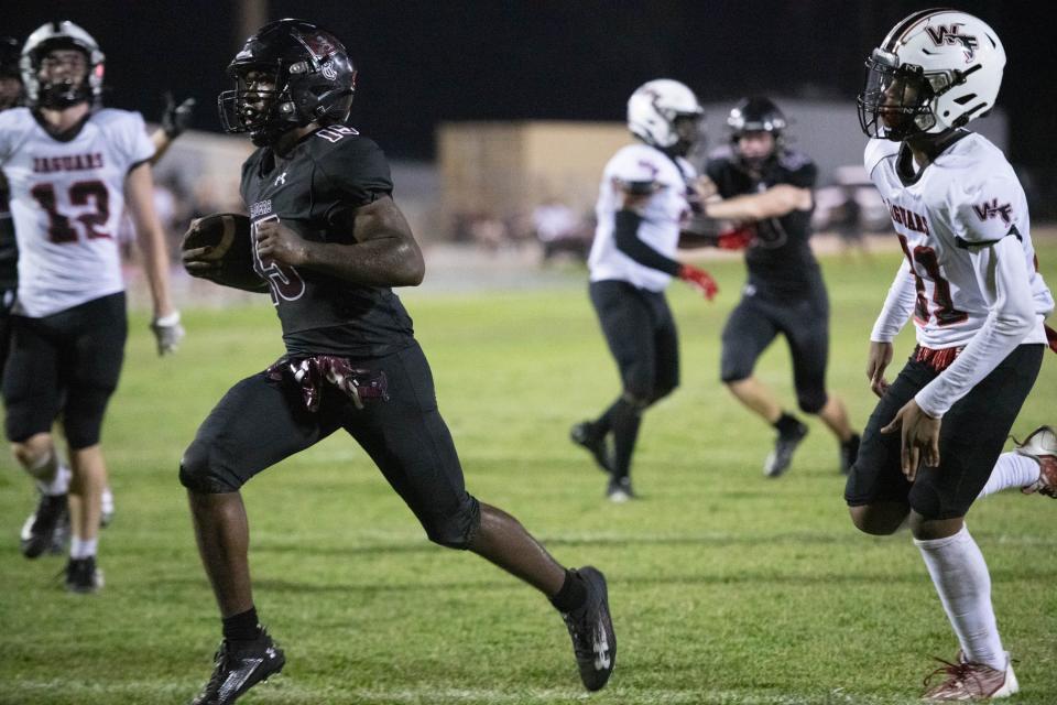 Josh Wilson (15) takes it into the end zone for a touchdown cutting the Jaguars lead to 26-19 during the West Florida vs Navarre preseason football game at Navarre High School on Friday, Aug. 18, 2023.