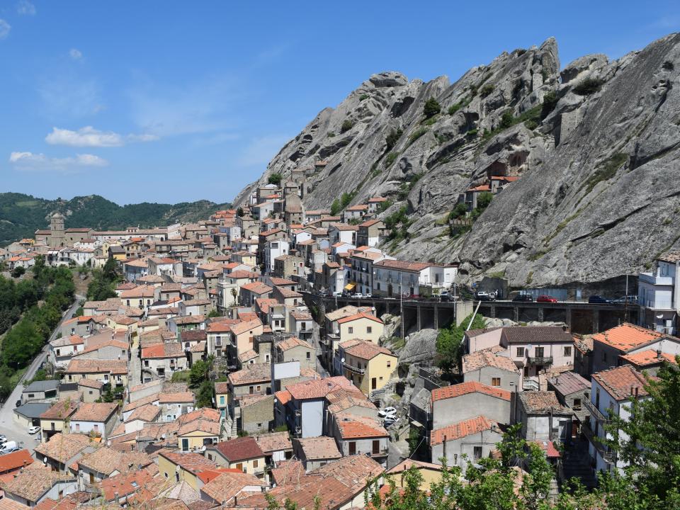 Houses and roads built into the side of a mountain.