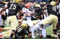 Oct 13, 2018; Nashville, TN, USA; Florida Gators running back Jordan Scarlett (25) runs for a short gain before being stopped by Vanderbilt Commodores defenders during the second half at Vanderbilt Stadium. Mandatory Credit: Christopher Hanewinckel-USA TODAY Sports