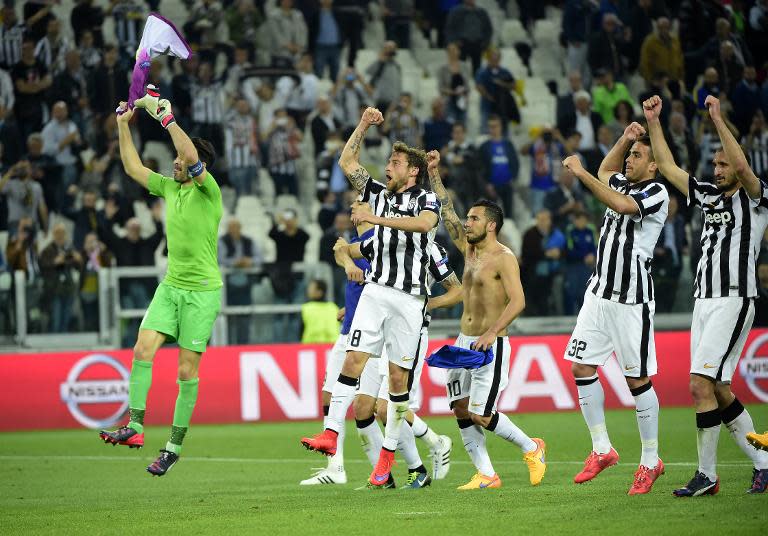 Juventus players celebrate after winning 1-0 their UEFA Champions League quarter-final, 1st leg match against Monaco, at the Juventus Stadium in Turin, on April 14, 2015