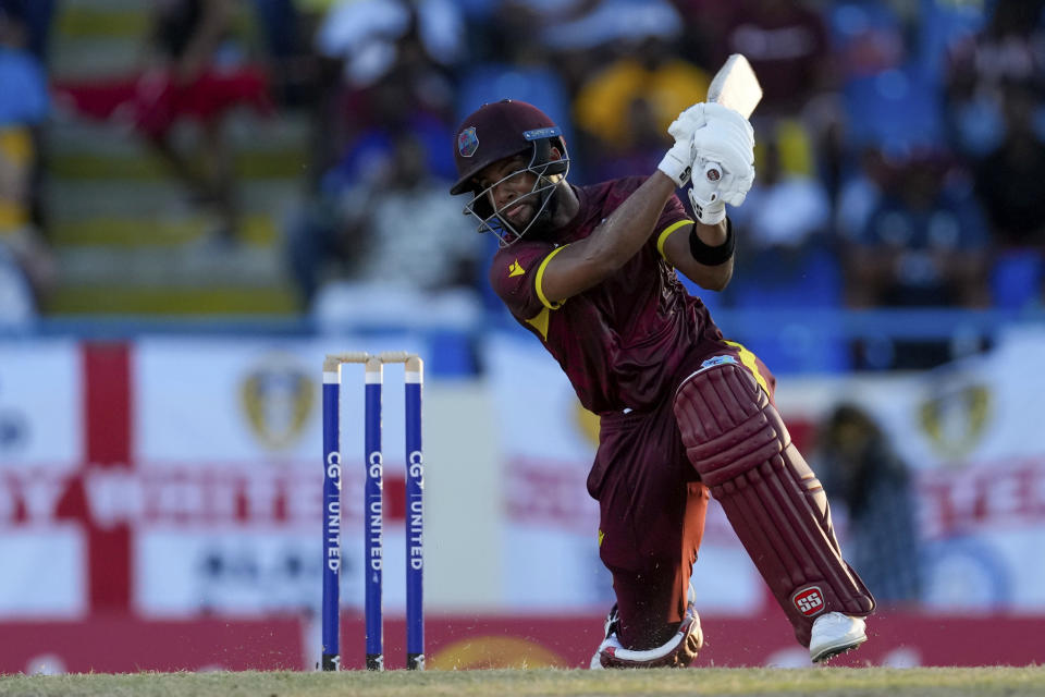 West Indies' captain Shai Hope hits a four against England during the first ODI cricket match at Sir Vivian Richards Stadium in North Sound, Antigua and Barbuda, Sunday, Dec. 3, 2023. (AP Photo/Ricardo Mazalan)