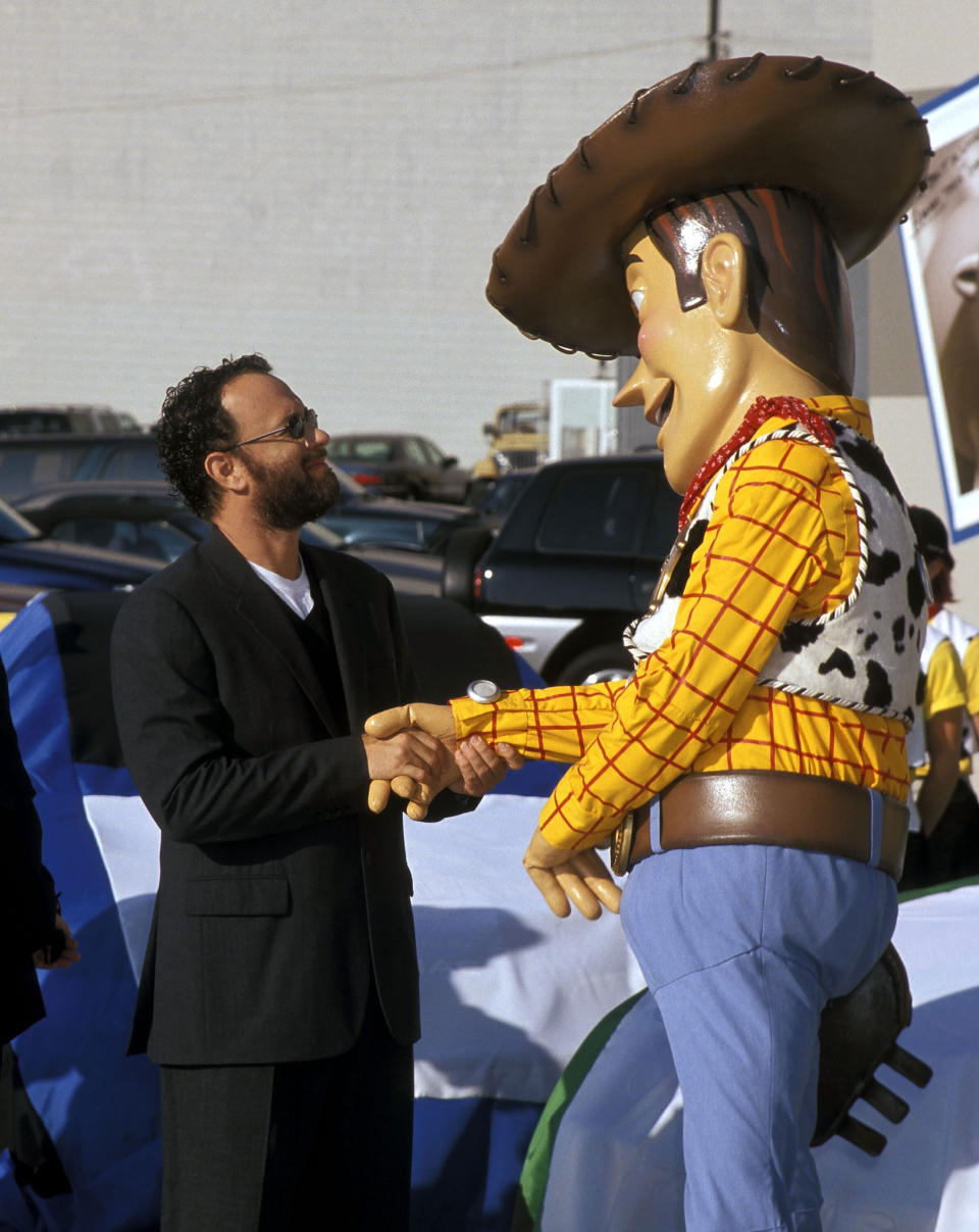 HOLLYWOOD - OCTOBER 23:   Actor Tom Hanks and Woody attend the "Toy Story 2" Themed NASCAR Racing Cars Unveiling on October 23, 1999 at the El Capitan Theatre in Hollywood, California. (Photo by Ron Galella, Ltd./WireImage)