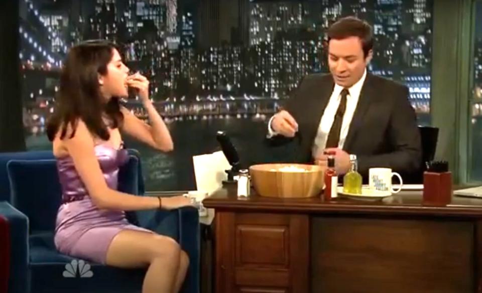 Selena Gomez and Jimmy Fallon eating popcorn